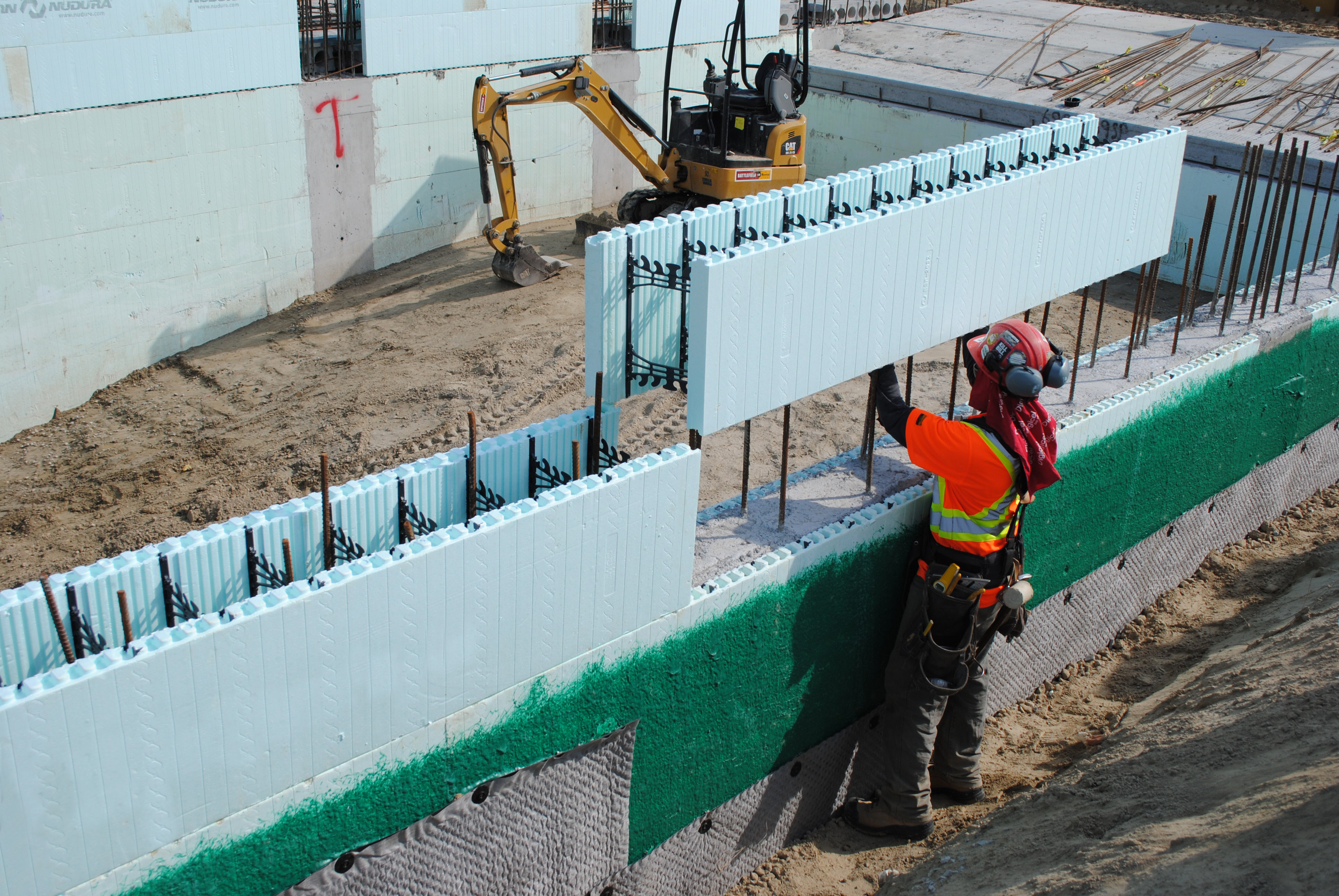 contractor stacking an icf block